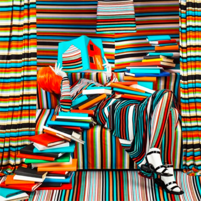 Patty Carroll, Striped Books: engrossed in her reading, the books coloured her life, 2018. Tirage chromogénique numérique 55 x 55 cm 26/04/19- 15/04/19. Women in Colour: Group exhibition. Galerie Miranda, 75010